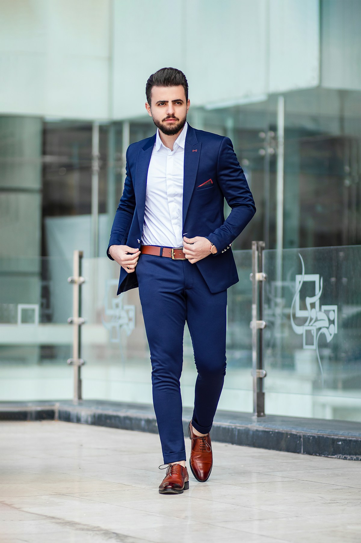 Man wearing a sharply tailored navy suit